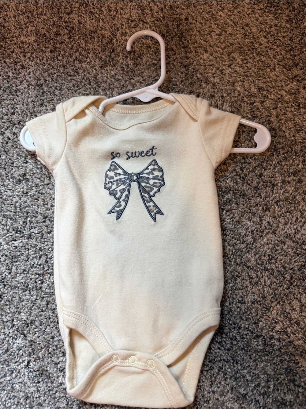 chick pea Cream Baby One-Piece Bodysuit with Gray Bow